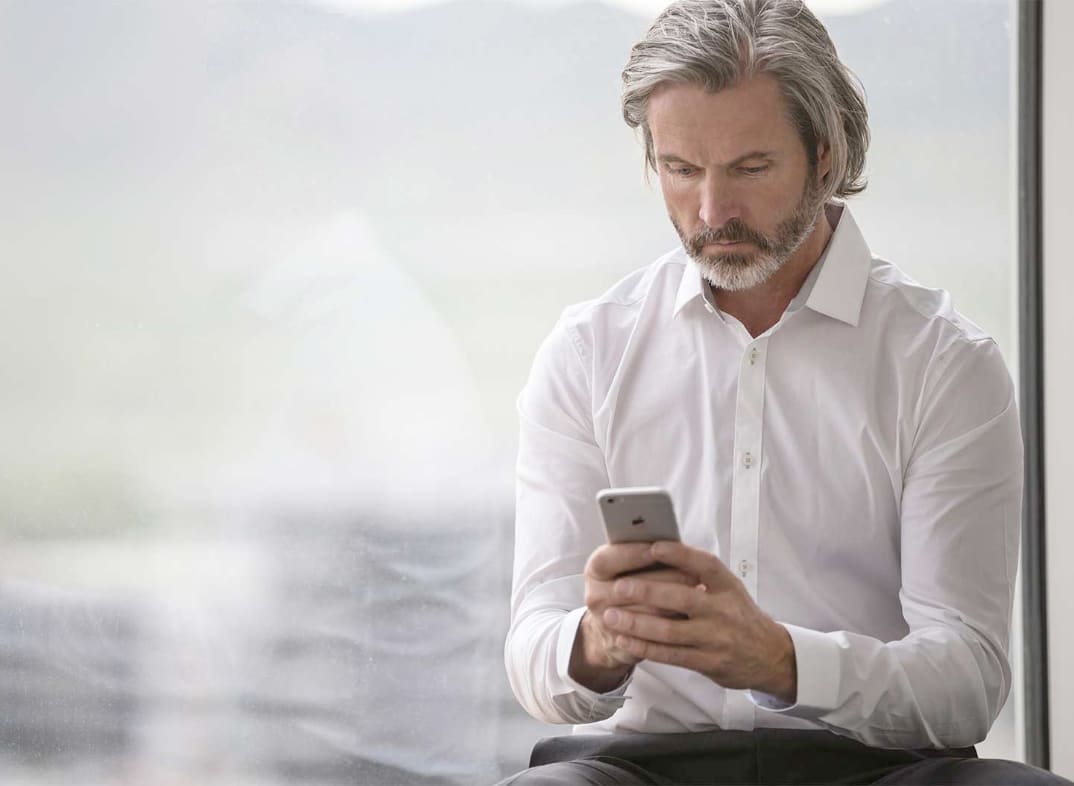 Businessman looking at his smartphone