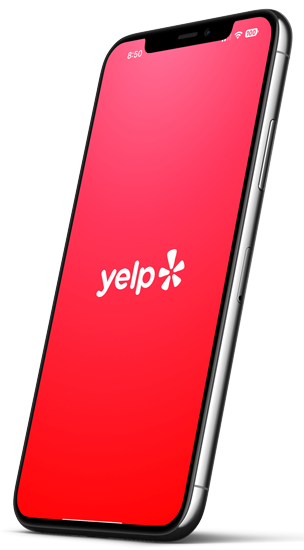 Image of a mobile device with the Yelp logo on the screen