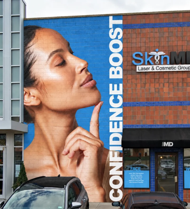 The Confidence Boost mural on the SkinMD building