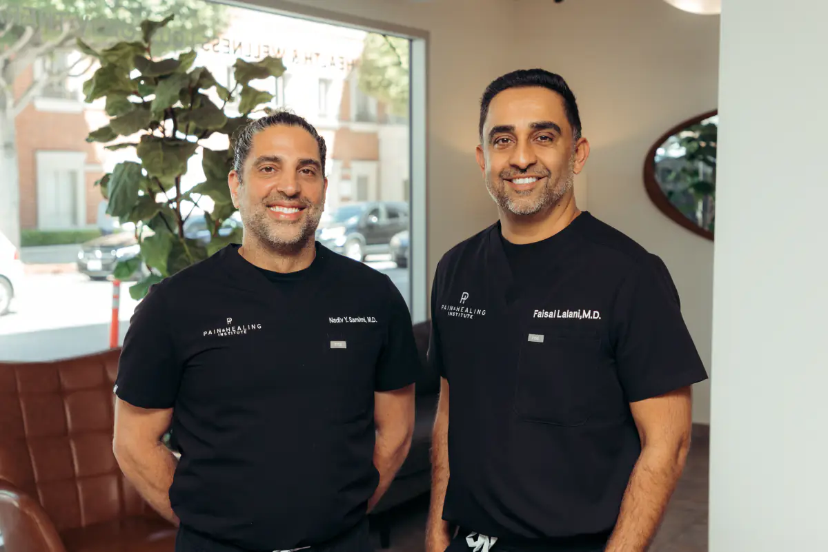 Dr. Faisal Lalani and Dr. Nadiv Samimi in the Pain & Healing Institute lobby.